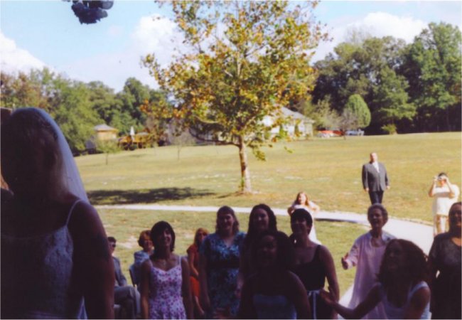 Bride Tossing The Bouquet